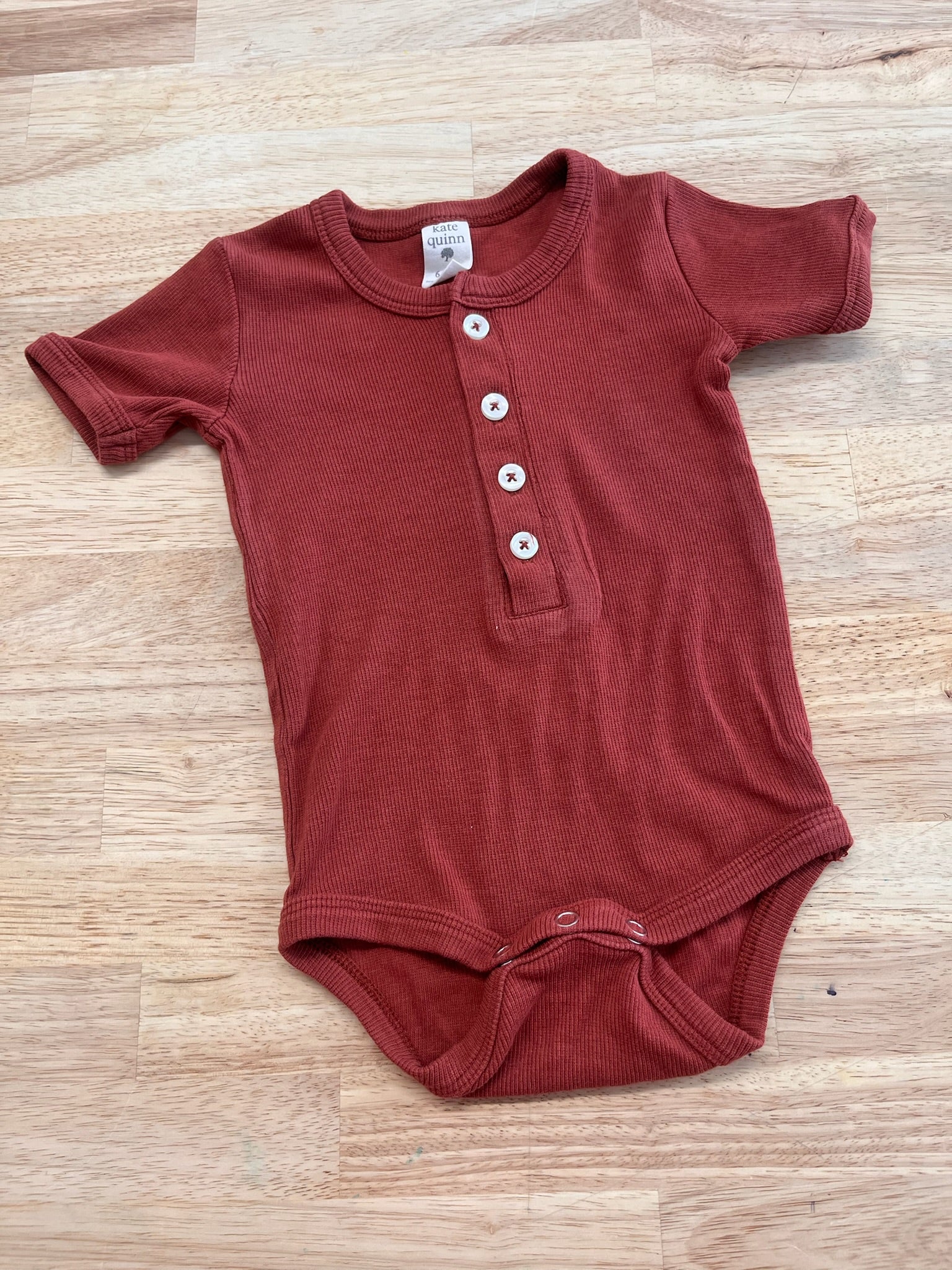 Kate Quinn 6-12M Ribbed Bodysuit – Brick Dust Red – Nest and Sprout