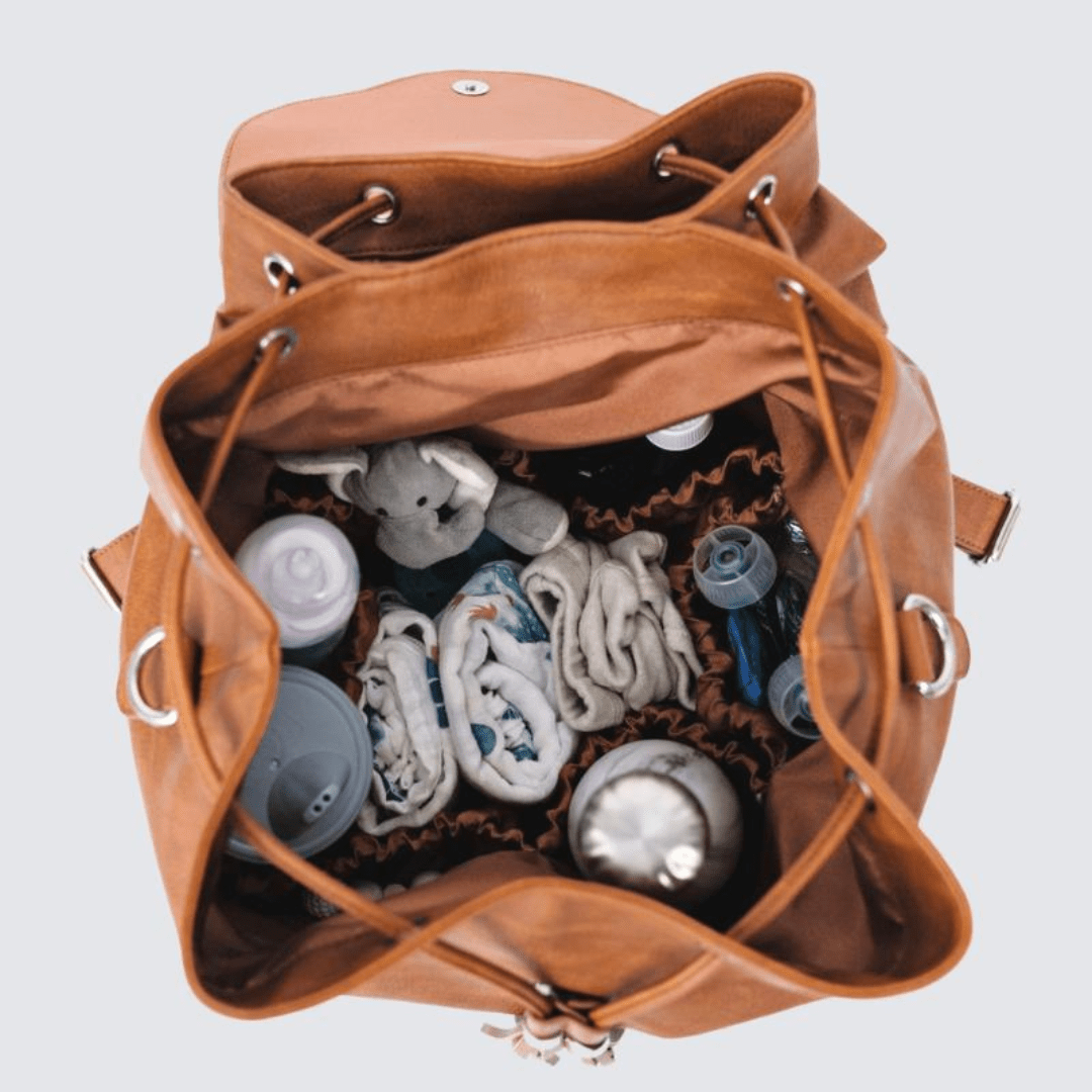 Don't Leave Home Without It: The Top 10 Must-Have Items for Your Diaper Bag - Nest and Sprout