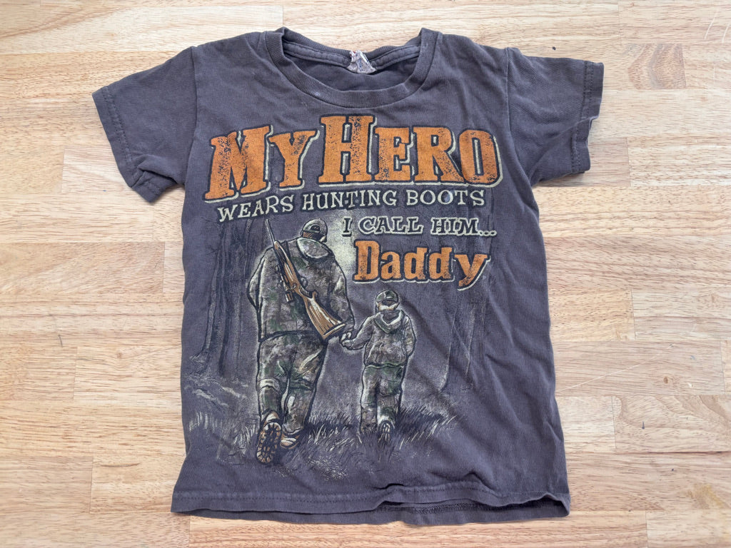 Graphic Tee “My Hero Wears hunting Boots” – Size XS (4Y) play condition