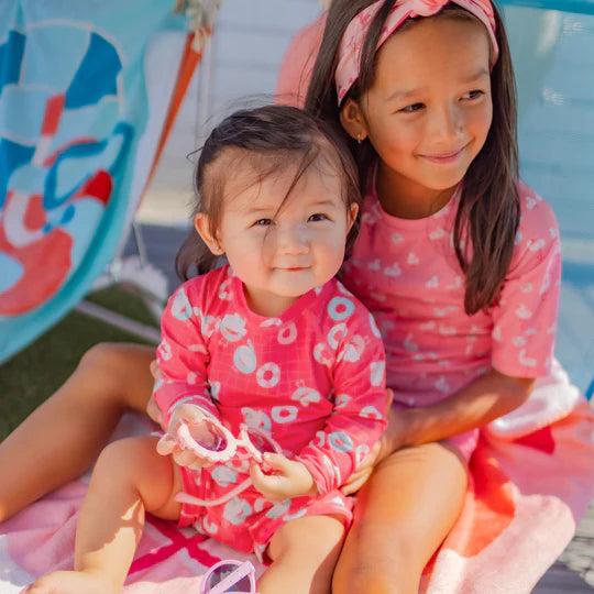 Pink one piece swimsuit with flamingo all over print