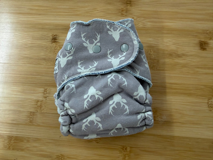TC Tooshies Fitted Cloth Diaper – One Size | Light Grey Antler Print Snap-In Booster | Play
