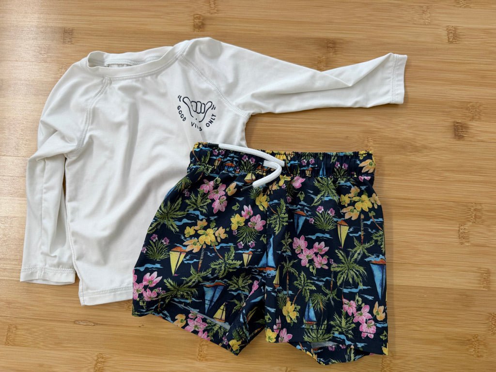 Old Navy Two-Piece Swim Set – 6–12M | Tropical Sailboat Shorts & White Long Sleeve Rash Guard | Play - Nest and Sprout-Consignment