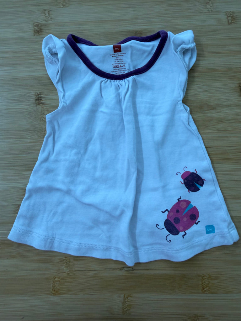 Tea Collection Top – 2 | White Ladybug with Ruffle Cap Sleeves