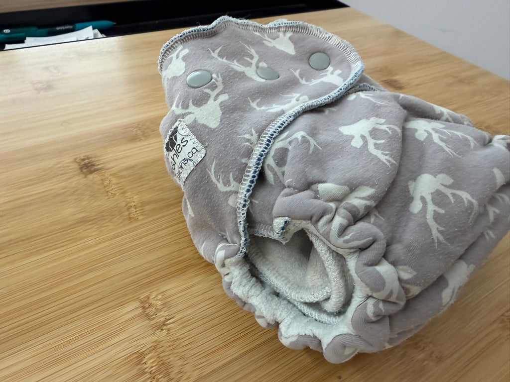 TC Tooshies Fitted Cloth Diaper – One Size | Light Grey Antler Print Snap-In Booster | Play