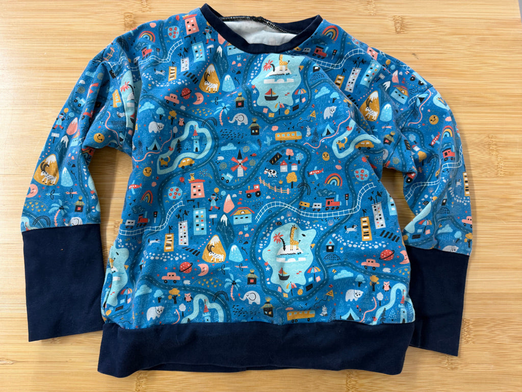 Grow By Zoe Grow With Me Shirt – Estimated 3-6 Years | Blue All-Over Animal and Village Print | Long Sleeve