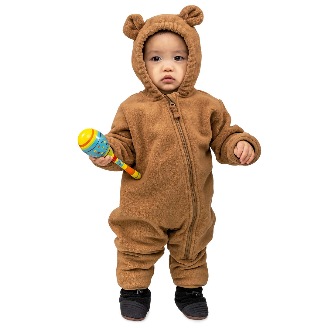 small child wearing a brown Jan & Jul Fleece Suit | Baby Outerwear standing in cozy booties and holding a toy