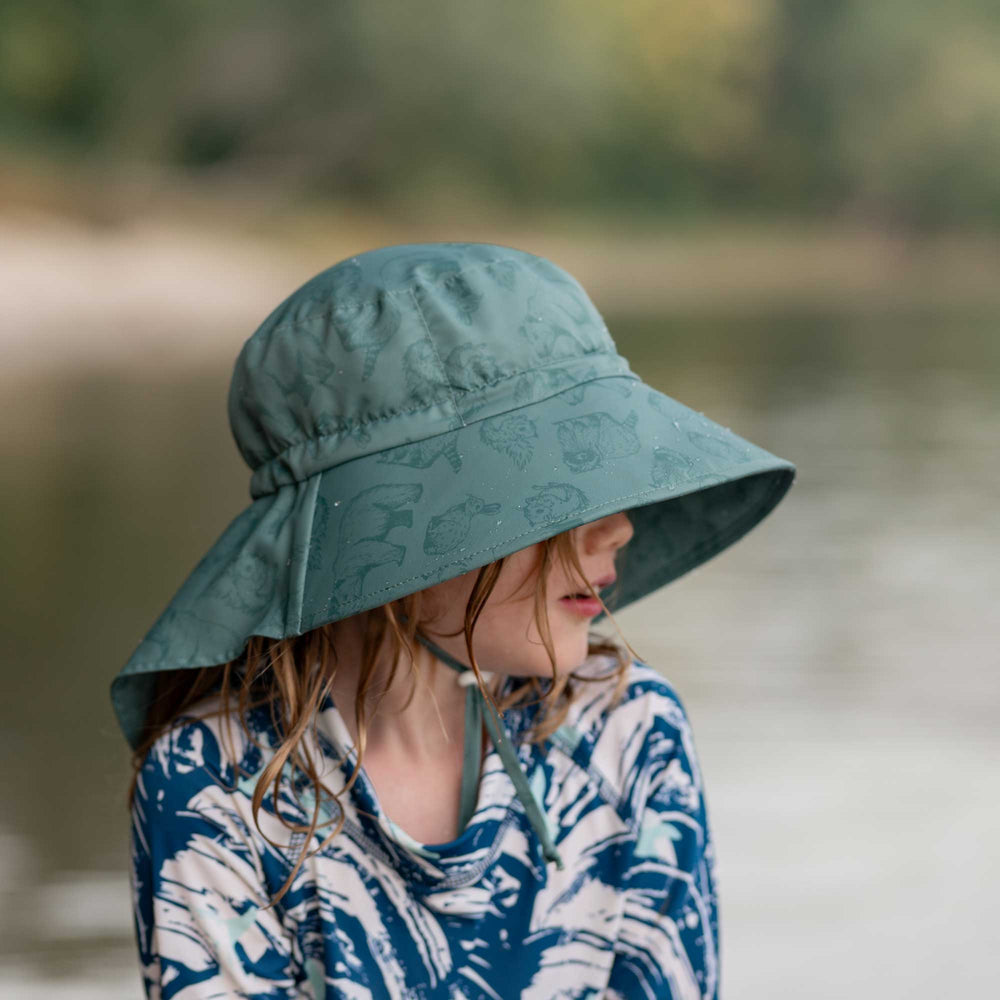 Child wearing the Jan & Jul Aqua Dry Adventure Hat  with full brim and neck coverage