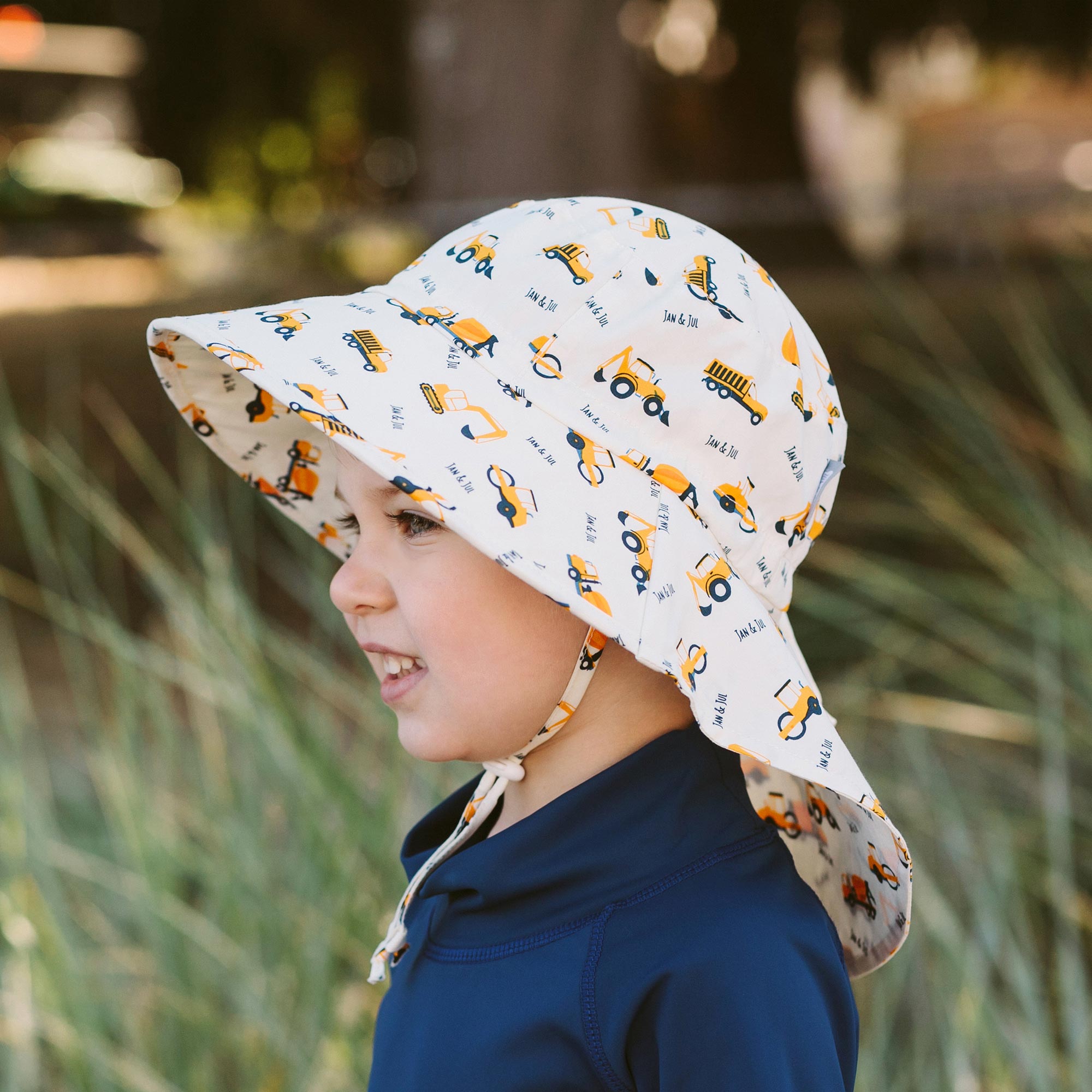 Child wearing the Jan & Jul Cotton Adventure Hat with full coverage