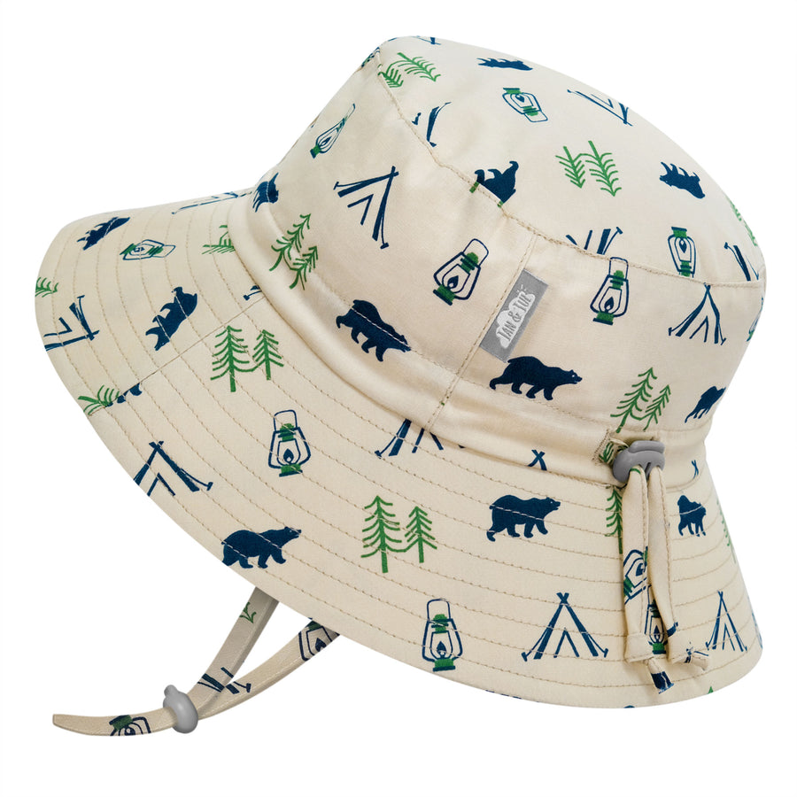 Jan & Jul Cotton Bucket Hat in Bear Camp - a beige hat with navy bears, tents, and green trees
