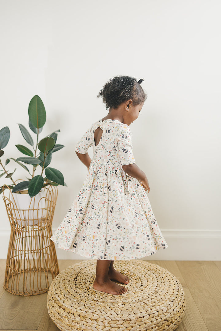 Lifestyle photo of a child wearing Skater Dress | Bumble Bees