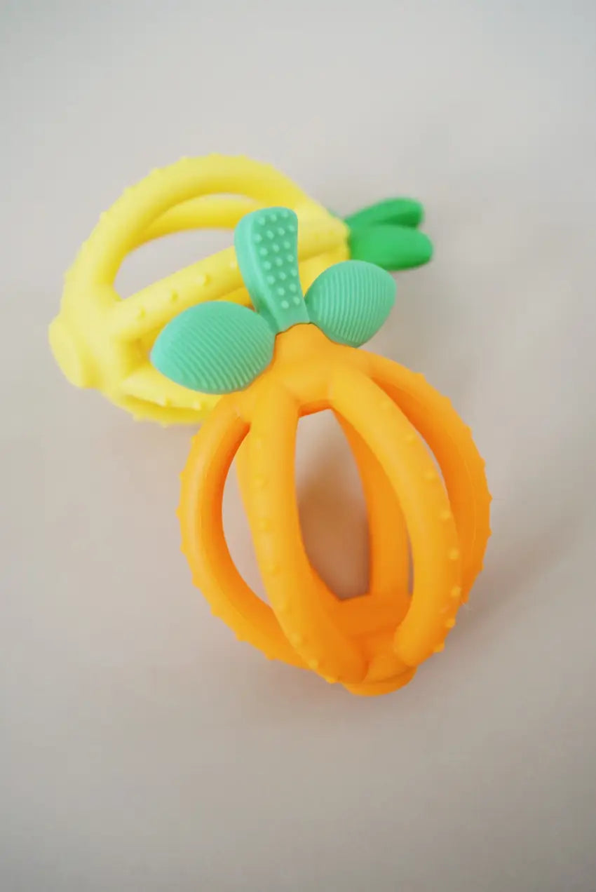 Two Bitzy Biter™ Teething Ball & Training Toothbrush together