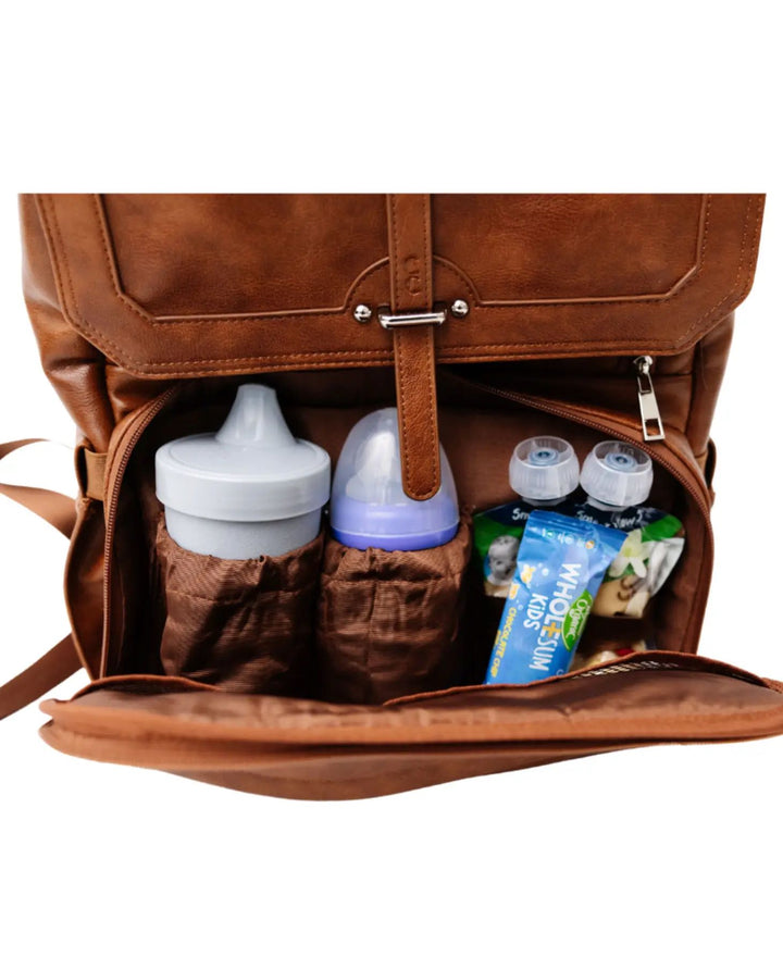 Front bottle pocket opened with snacks and bottles Citi Collective Citi Navigator Diaper Bag | Saddle Brown