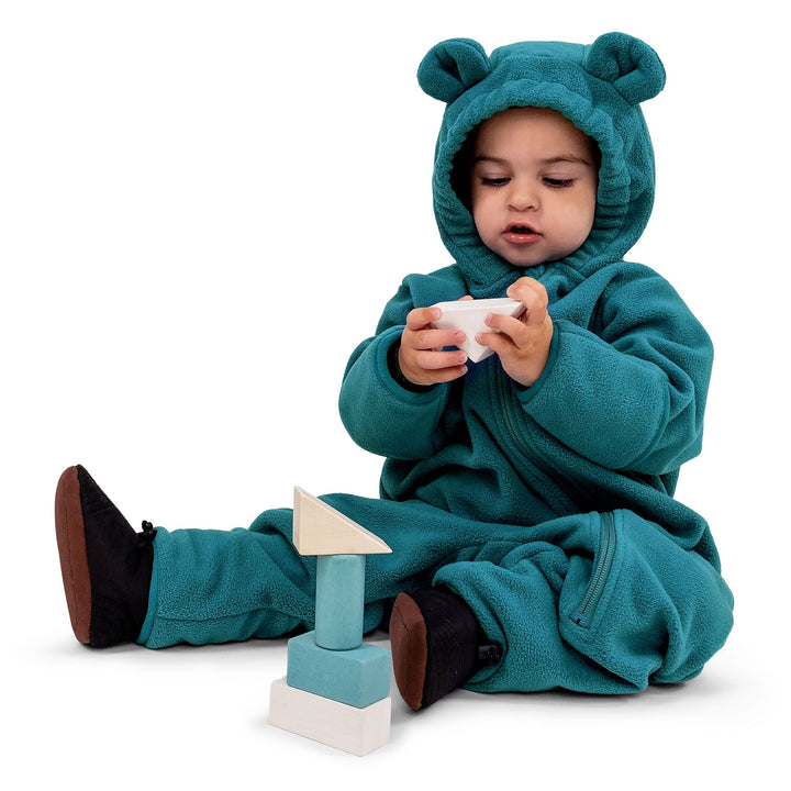 Child sitting in the Jan & Jul Fleece Suit | Baby Outerwear in the colour way Blue Spruce