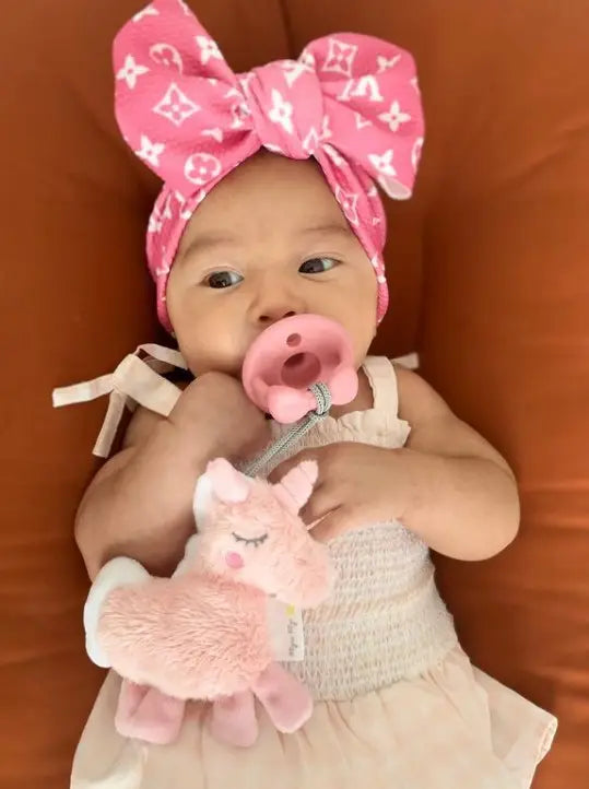 Child with the unicorn pacifier