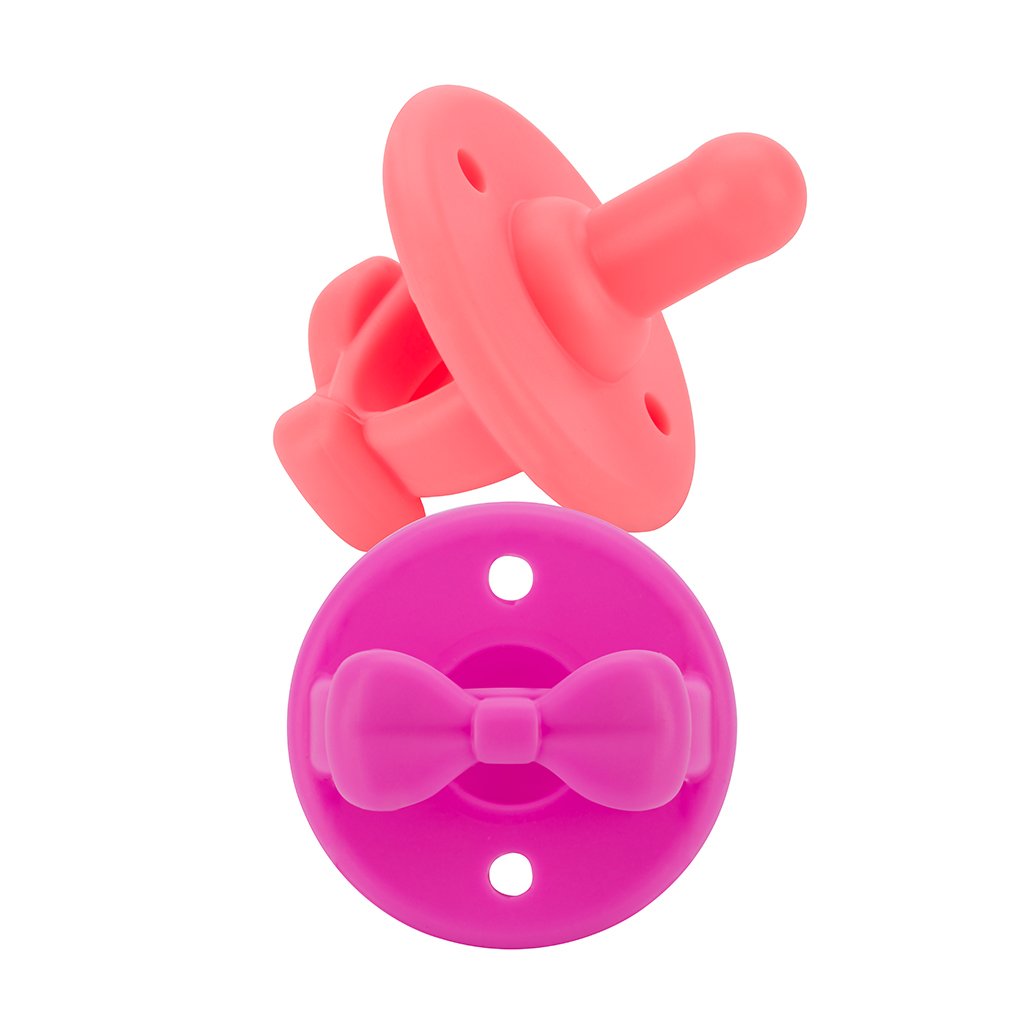 guava and dragon fruit bows Sweetie Soother™ | 2 Pack of Silicone Soothers from Itzy Ritzy